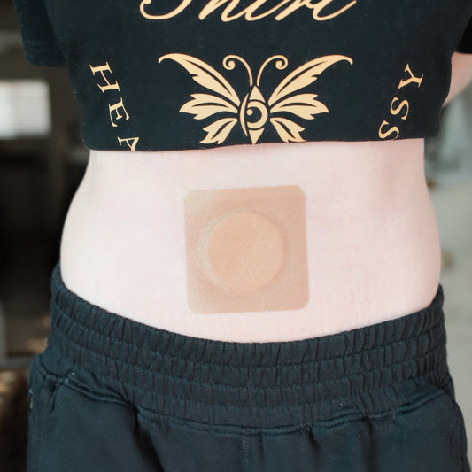 A disposable navel patch placed over the belly button for overnight castor oil navel oiling
